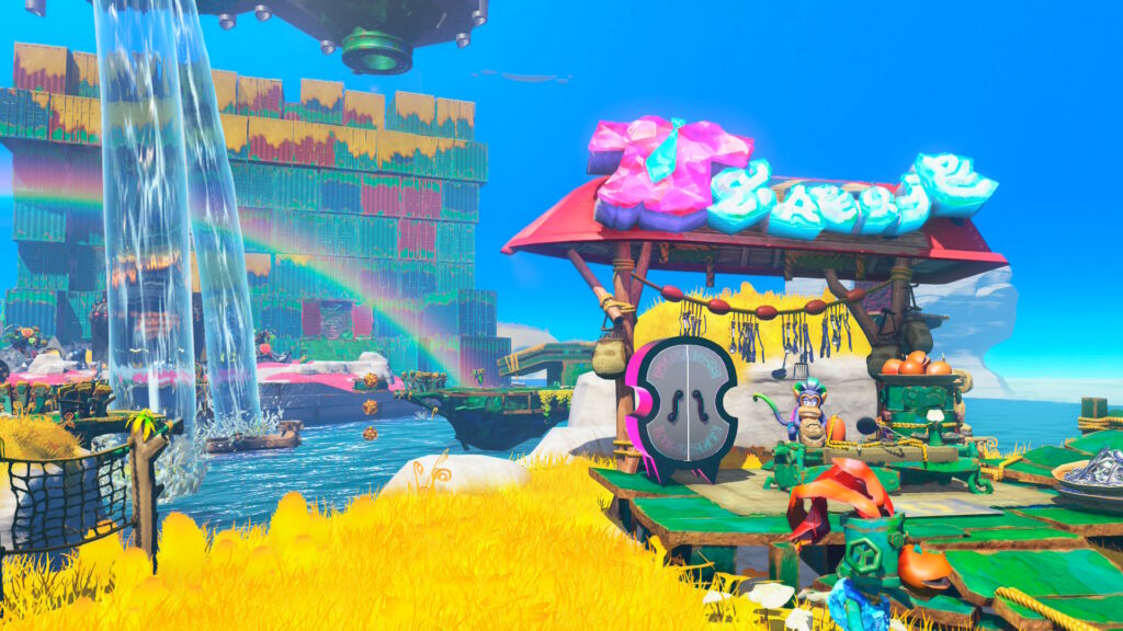 Donkey Kong Bananza lagoon screenshot with waterfall and rainbow.